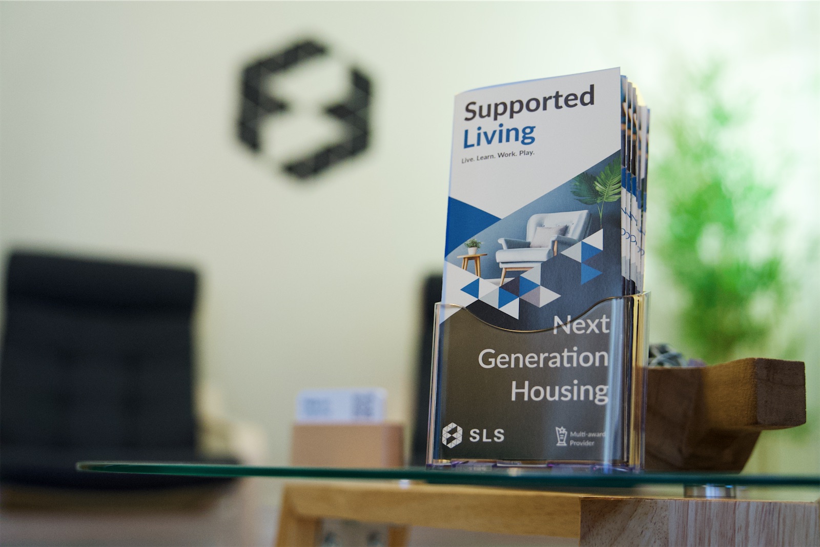 SLS Supported Living information leaflets displayed in the Eden House reception area.